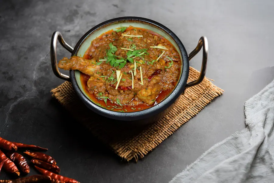 Signature curry served in a karahi