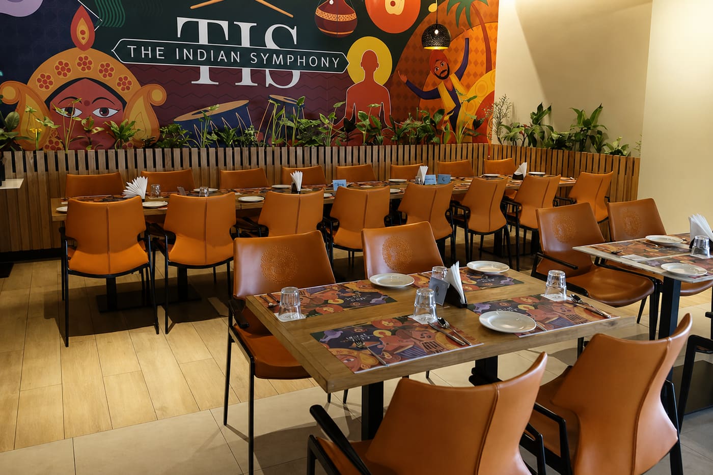 The mural wall and long table at The Indian Symphony